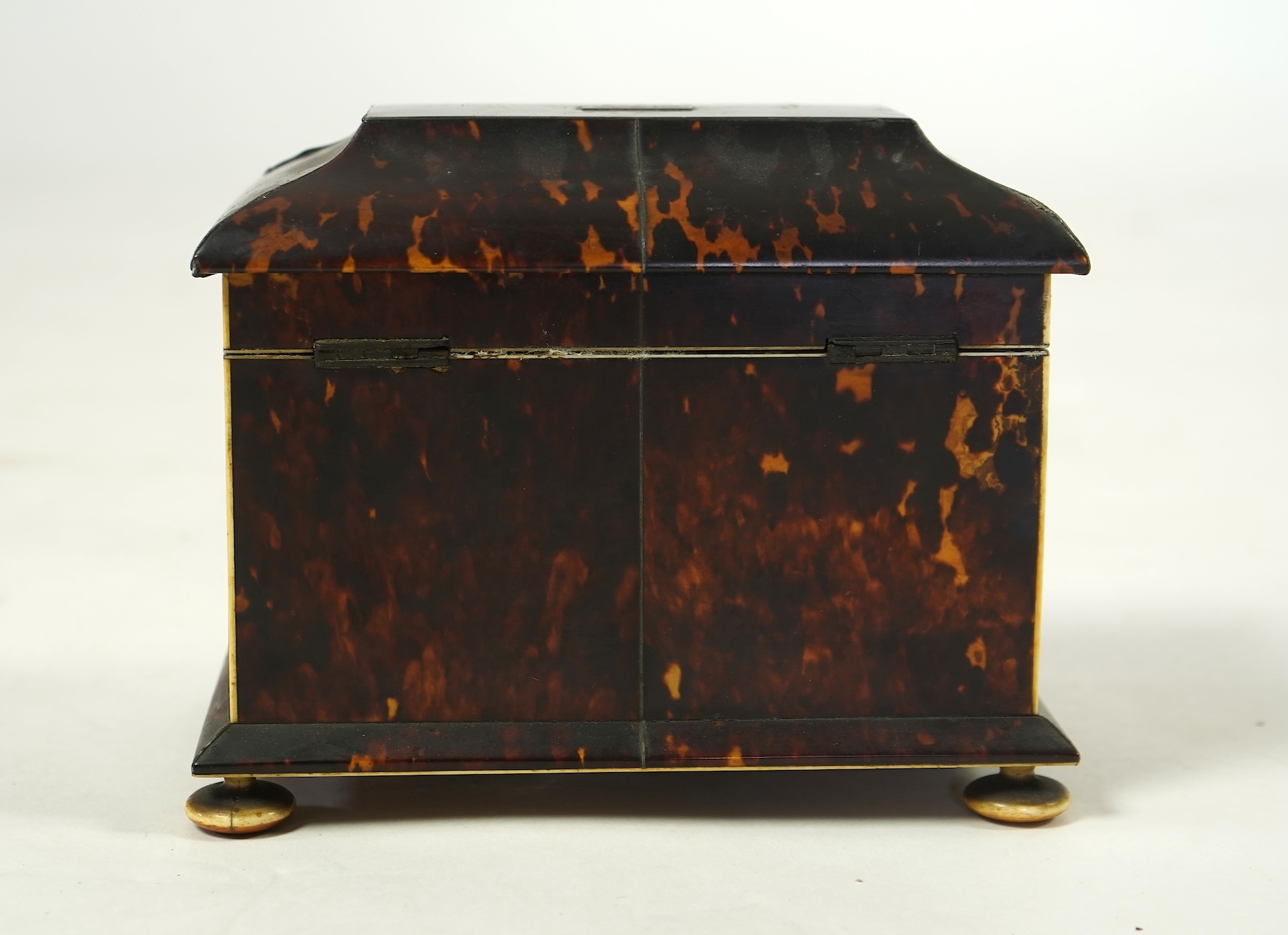 An early Victorian tortoiseshell tea caddy